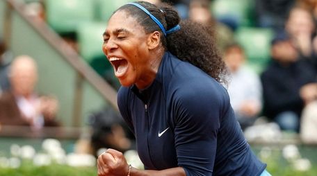 Serena Williams clenches her fist after scoring a