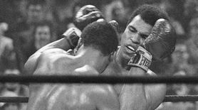 Heavyweight champion Joe Frazier, left, has challenged Muhammad