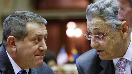 Former Assembly Speaker Sheldon Silver, right, talks with
