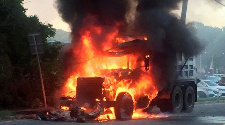 Flames engulf a 10-wheel dump truck on Park