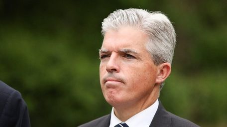 Suffolk County Executive Steve Bellone looks on during