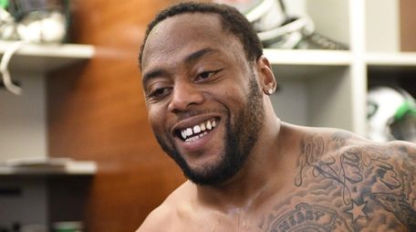 New York Jets linebacker Erin Henderson answers questions