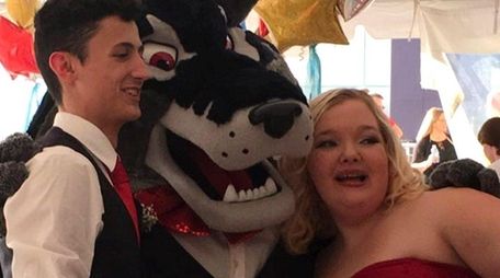 Erin Knox and Joe Witek meet hospital mascot
