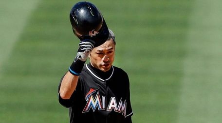 Miami Marlins batter Ichiro Suzuki of Japan tips