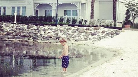 Jennifer Venditti's son wades in Seven Seas Lagoon