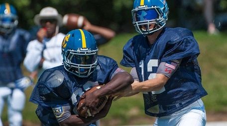 Long Island Senior Jude Innocent (25, left, of