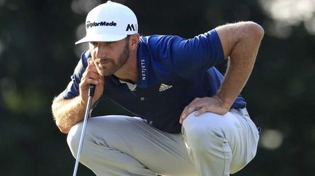 Dustin Johnson of the US lines up his