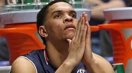 Auburn's Tyler Harris sits on the bench during