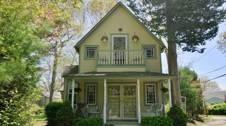 This Jamesport cottage has central air conditioning and