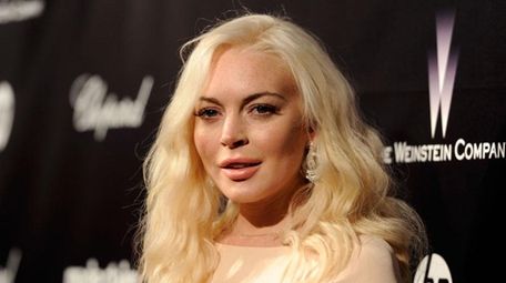 Actress Lindsay Lohan arrives at The Weinstein Company's