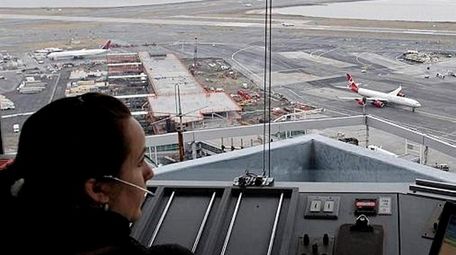 An air traffic controller at Kennedy Airport, Jan.