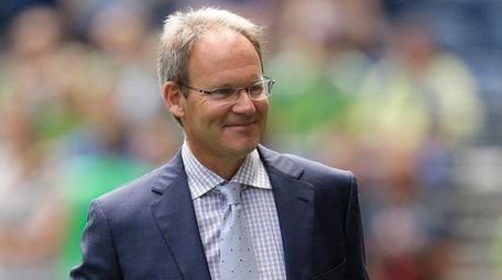 Seattle Sounders interim coach Brian Schmetzer walks on