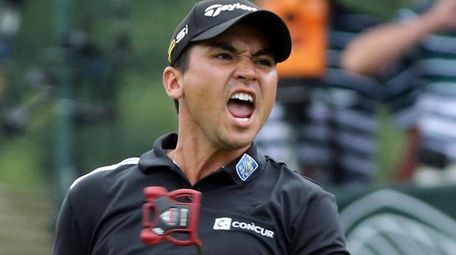Jason Day reacts after making an eagle putt
