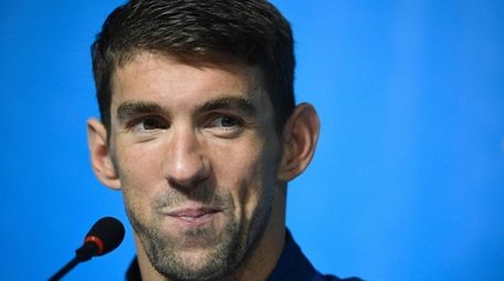 U.S. swimmer Michael Phelps holds a press conference