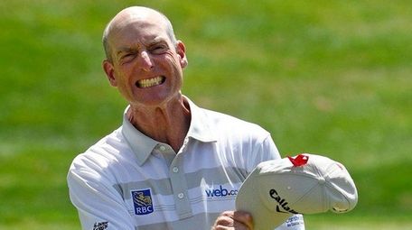 Jim Furyk celebrates after shooting a course and