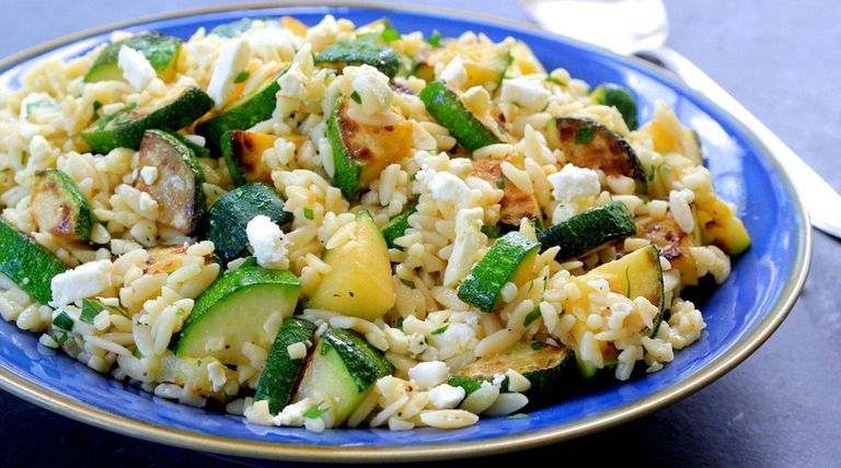 Lightly sautéed zucchini tossed with orzo, feta, lemon,