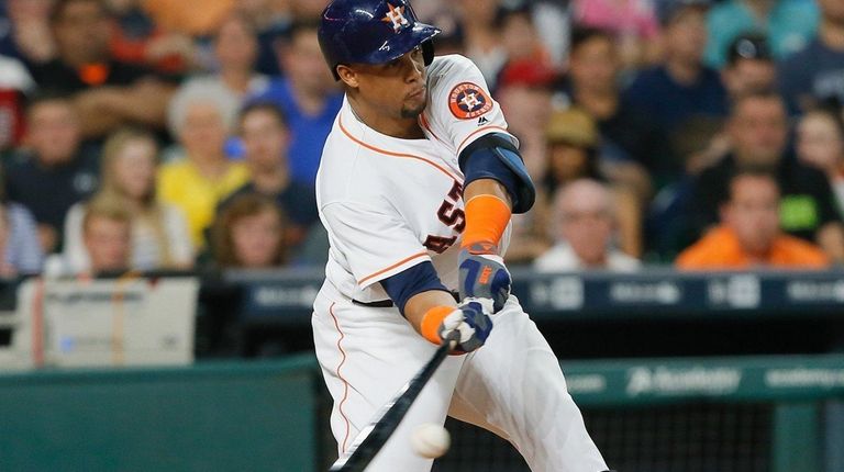 Carlos Gomez #30 of the Houston Astros singles