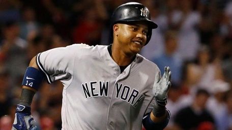New York Yankees' Starlin Castro runs out his