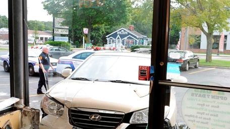 Car into a storefront of Lemon Tree hair