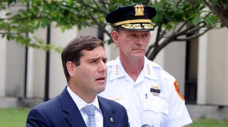 Suffolk County commissioner Tim Sini, left, during a