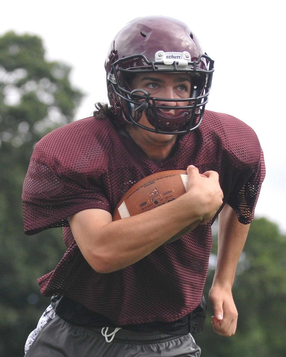 Ryan Aughavin, North Shore quarterback, runs the ball