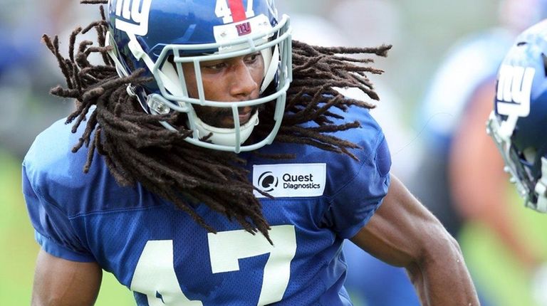 New York Giants cornerback Joe Powell (47) drops