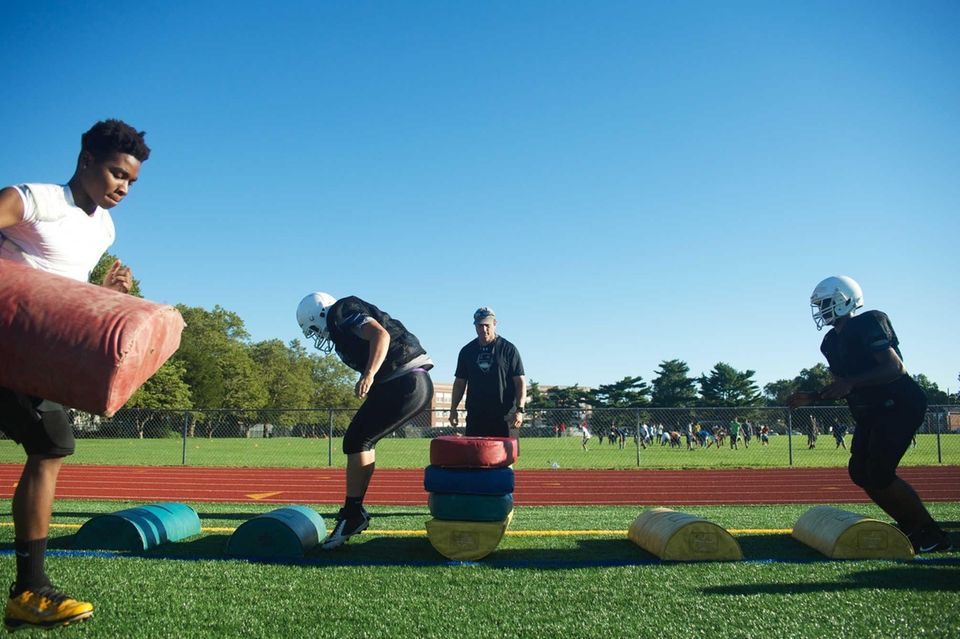 Players do agility drills during practice at Sewanhaka