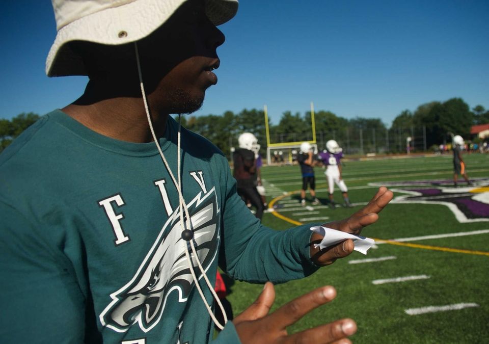 Coach Derrick McNae gives instructions during practice at