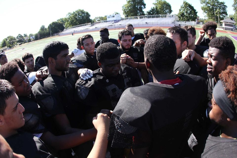 Players celebrate the end of practice at Sewanhaka