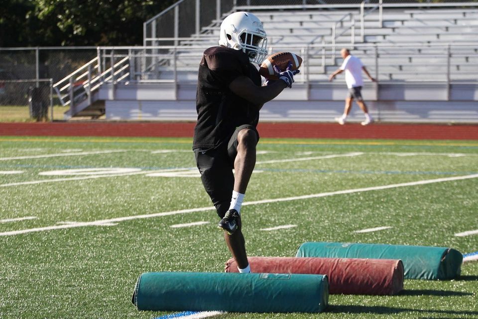 Players do agility drills during practice at Sewanhaka