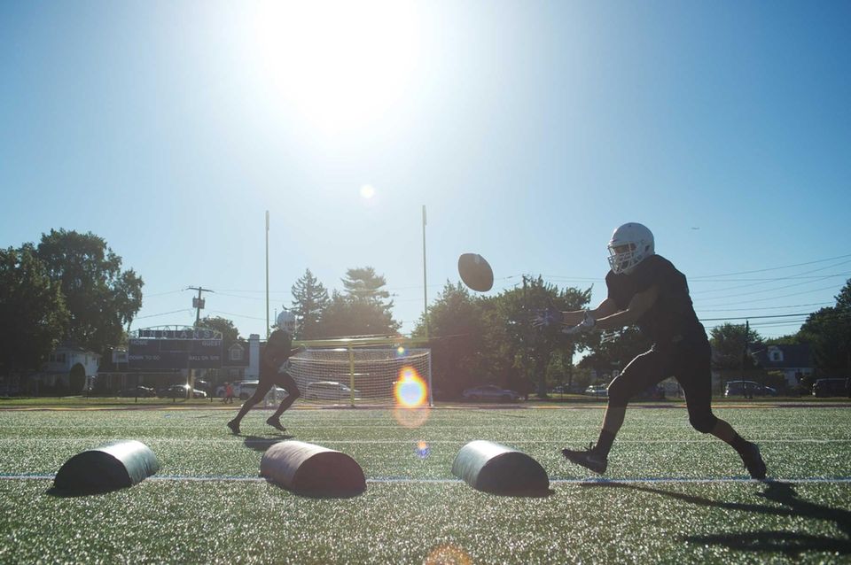 Players do agility drills during practice at Sewanhaka