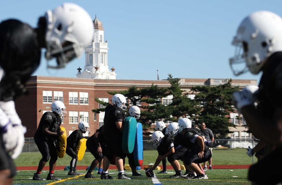 Players get ready for drills during practice at
