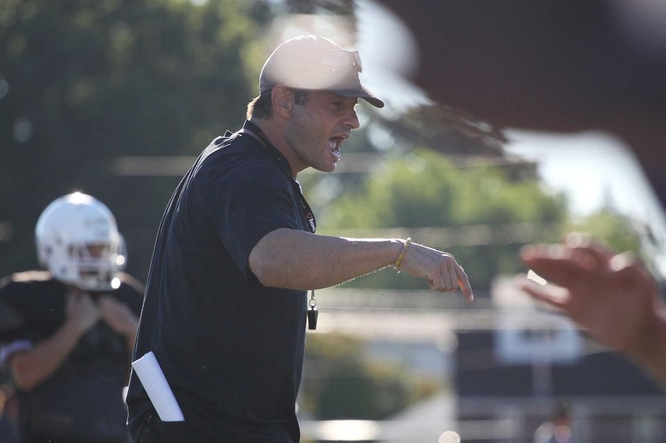 Head coach George Kasimatis gives instructions during practice
