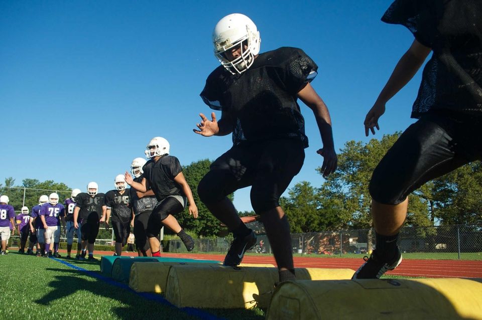 Players do agility drills during practice at Sewanhaka