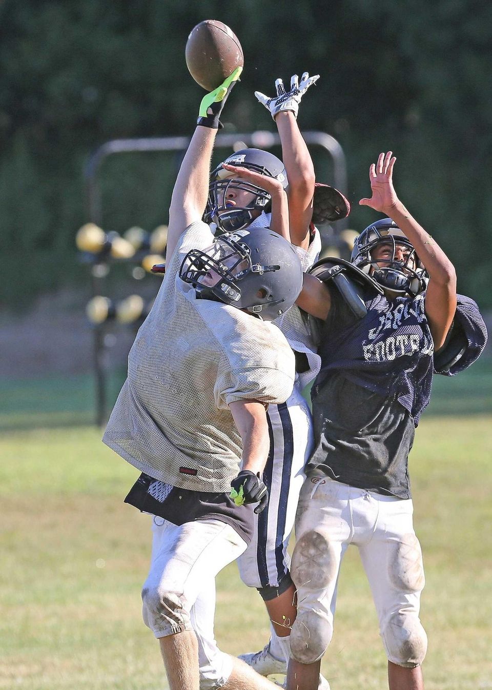 Ball knocked away at Jericho football practice at