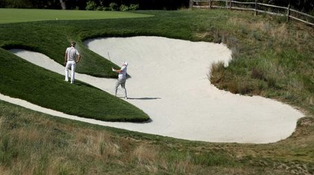 Robert Garrigus plays his second shot on the