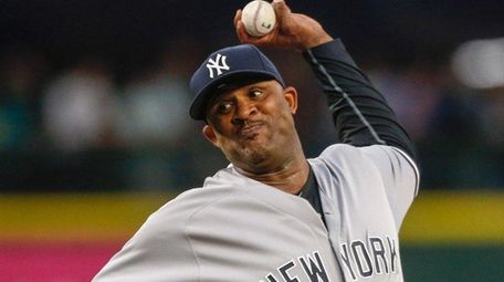 CC Sabathia pitches against the Mariners in the