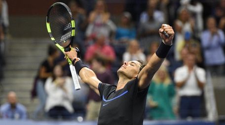 Rafael Nadal of Spain reacts after he wins