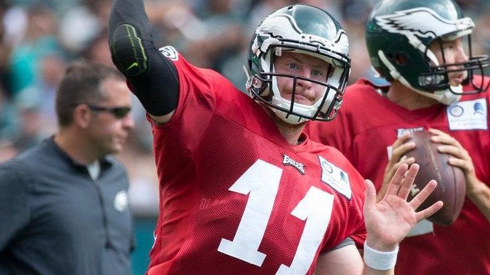 Philadelphia Eagles quarterback Carson Wentz, left, throws the
