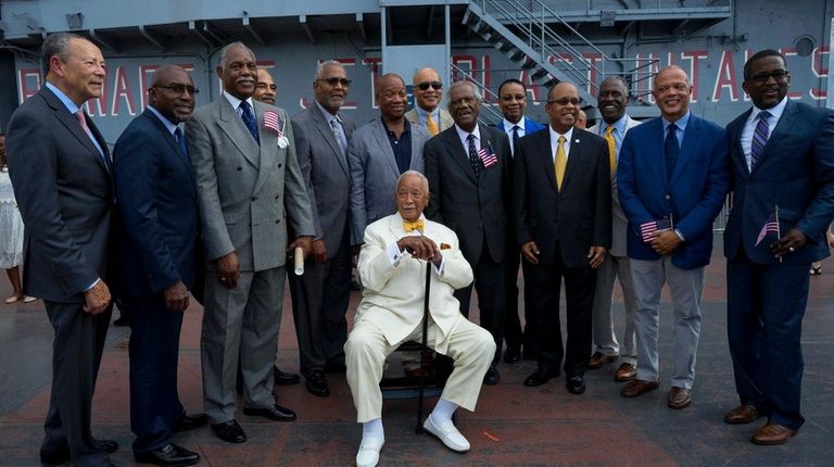 Former New York mayor David Dinkins sits as
