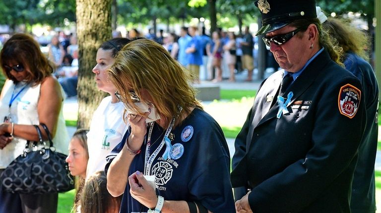 Kristen Alverson cries during a moment of silence