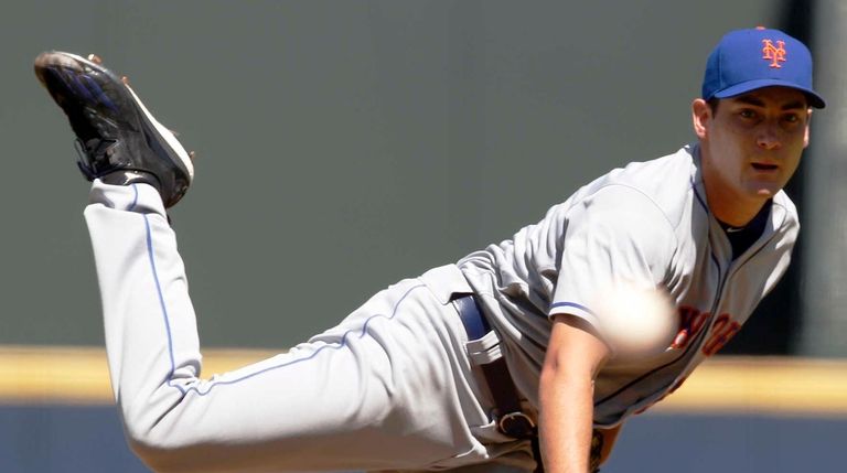 New York Mets starting pitcher Seth Lugo throws