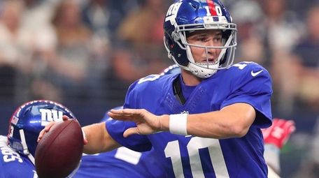 Eli Manning of the New York Giants drops