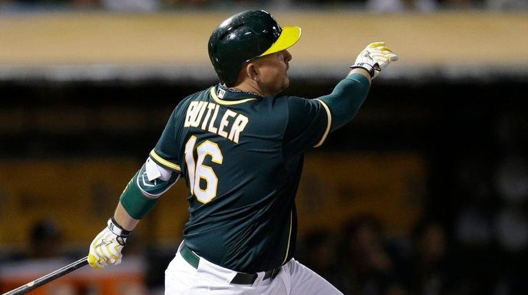 Oakland Athletics' Billy Butler watches his RBI sacrifice