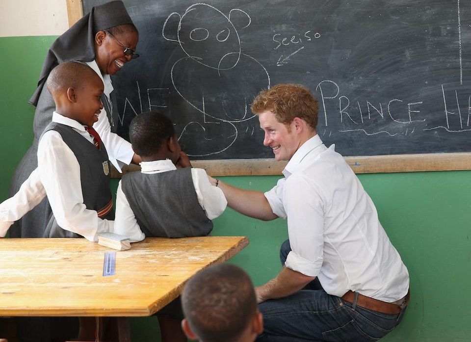 Prince Harry learns sign language as he visits