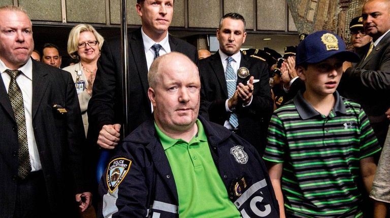 NYPD Officer Brian O'Donnell is pictured leaving Bellevue