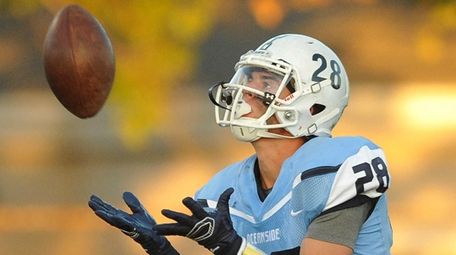 Oceanside's Dylan Judd catches the kickoff against Farmingdale