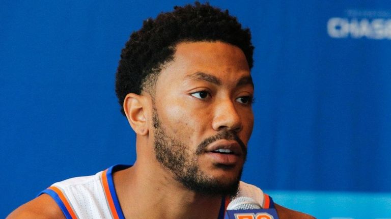 Derrick Rose speaks during a news conference at