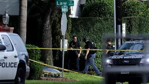 Police investigate the scene of a shooting that