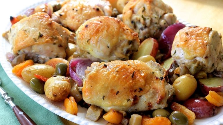 Chicken is roasted on a bed of eggplant,